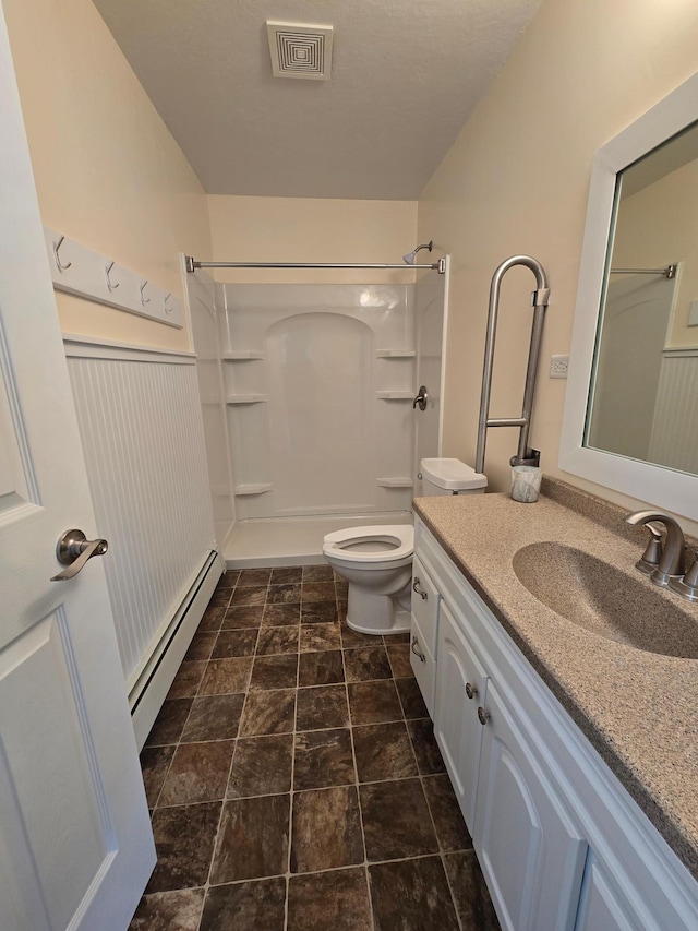 full bathroom featuring visible vents, a shower, toilet, baseboard heating, and vanity