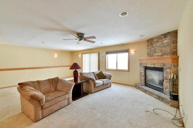 carpeted living room with a fireplace and a textured ceiling