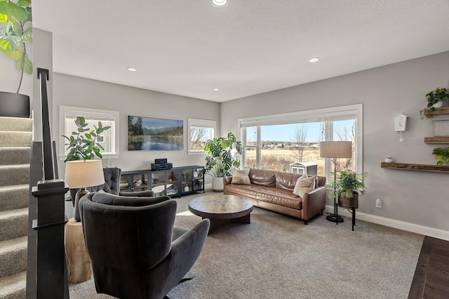 living room with recessed lighting, baseboards, and stairs