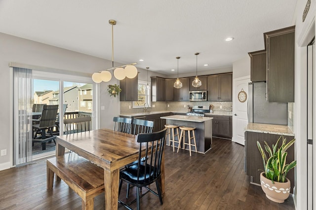 dining room featuring recessed lighting and dark wood-style floors