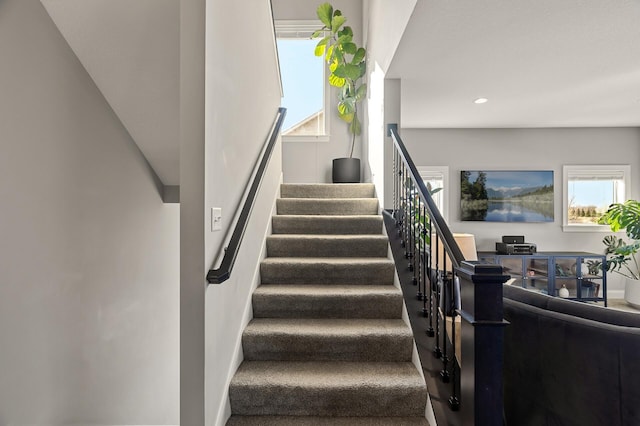 staircase with recessed lighting and carpet