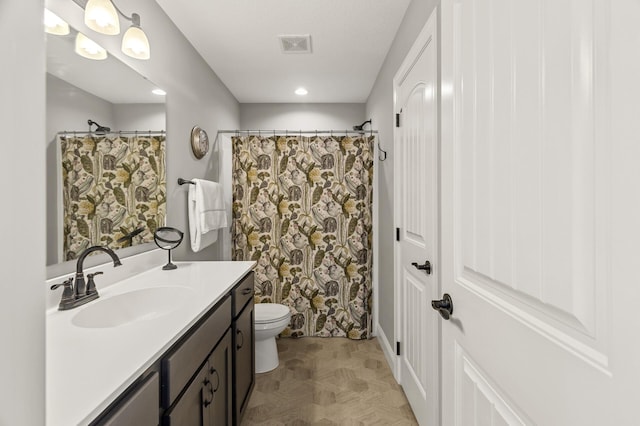 full bath with visible vents, toilet, vanity, and a shower with shower curtain