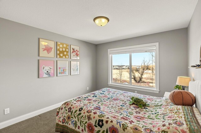 carpeted bedroom with baseboards