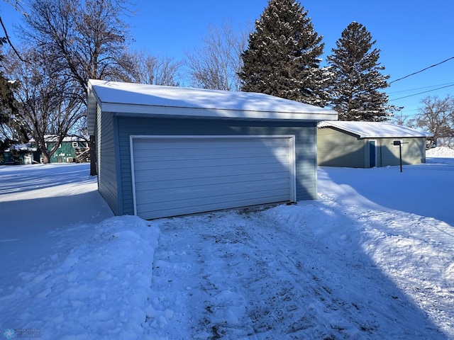 view of snow covered garage