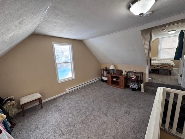 bonus room with a baseboard heating unit, vaulted ceiling, a textured ceiling, and dark colored carpet