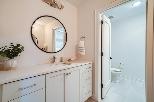 bathroom with vanity and toilet