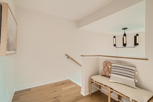 interior space with wood-type flooring and a notable chandelier