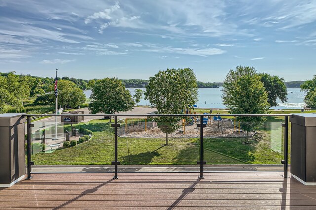 wooden terrace featuring a water view