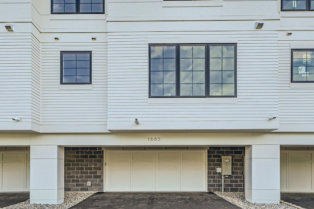 view of side of property featuring a garage