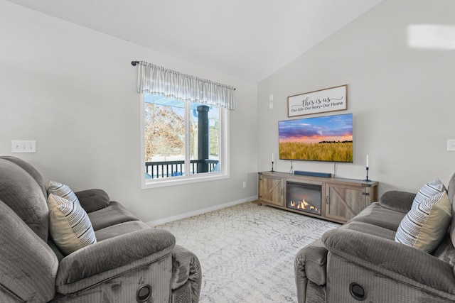 carpeted living room with vaulted ceiling