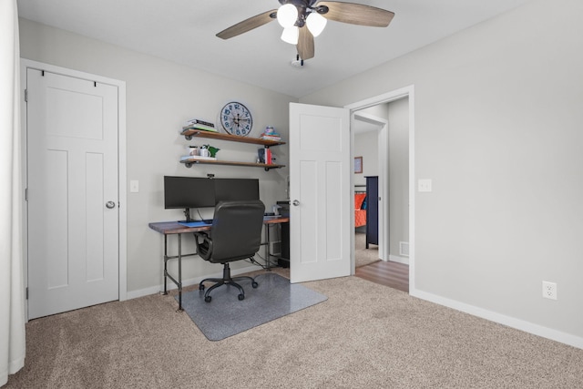 office space with carpet floors and ceiling fan