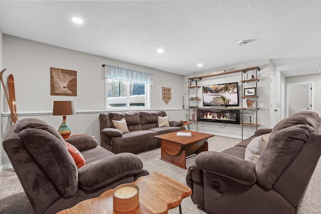 carpeted living room with a textured ceiling