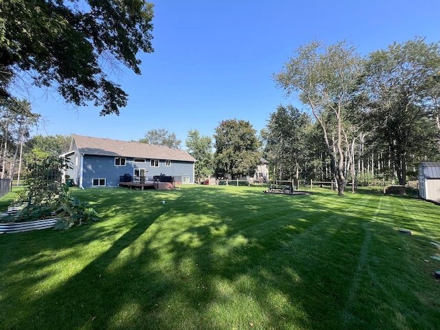 view of yard featuring a wooden deck