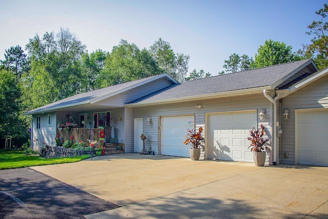 ranch-style house with driveway, an attached garage, and a porch