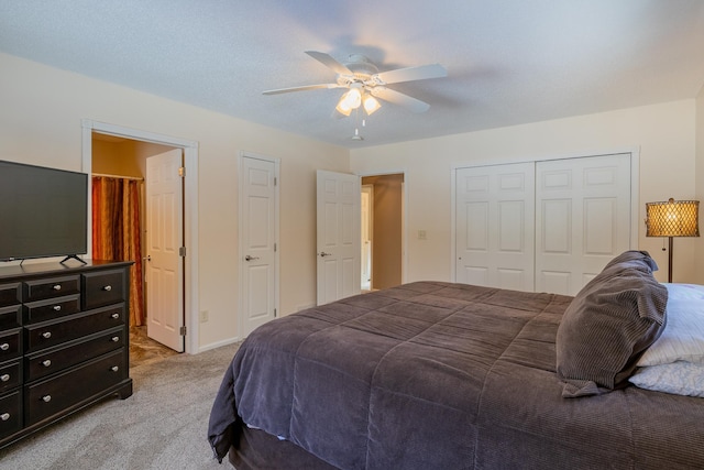 bedroom featuring carpet, ceiling fan, and a closet