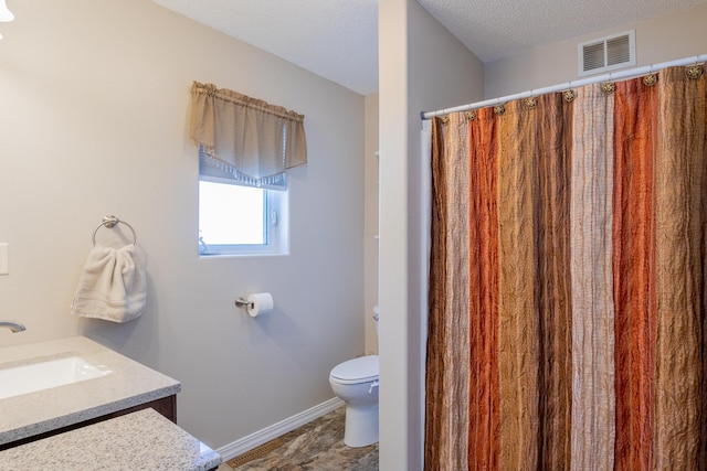 full bath featuring baseboards, visible vents, toilet, a textured ceiling, and vanity