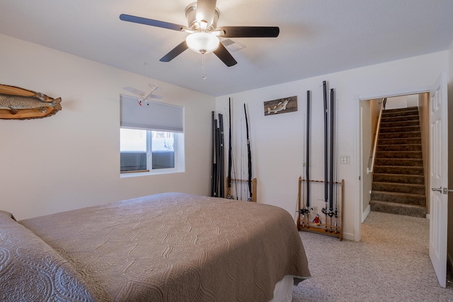 bedroom with a ceiling fan and light colored carpet