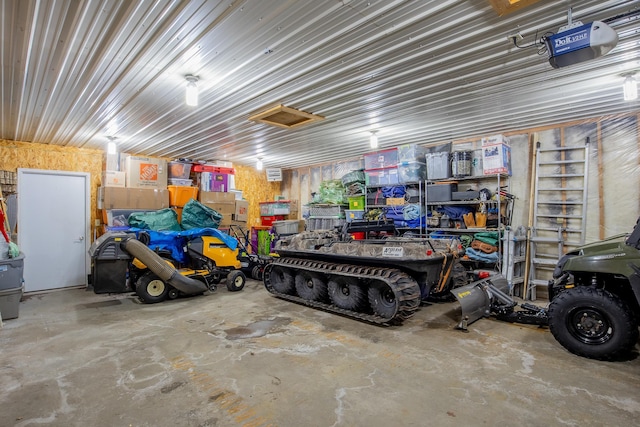 garage with metal wall and a garage door opener