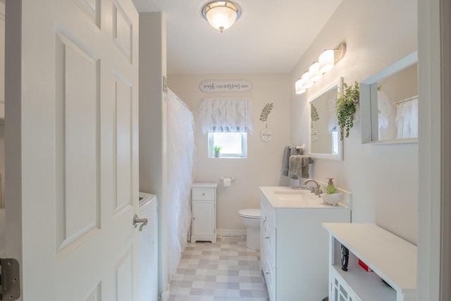 2955 Saint Onge Dr NE, Bemidji, MN 56601 - bathroom with vanity, toilet, tile patterned floors, baseboards, and a shower with curtain