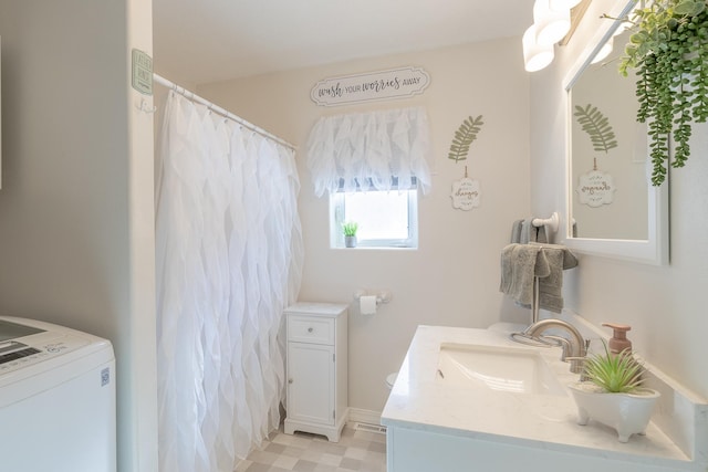 2955 Saint Onge Dr NE, Bemidji, MN 56601 - bathroom featuring washer / dryer, vanity, and a shower with shower curtain