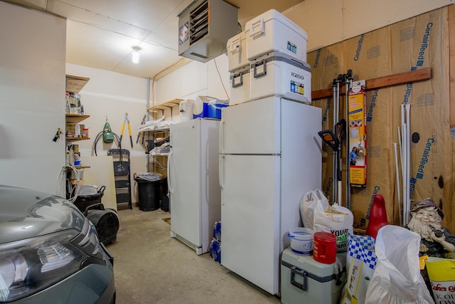 2955 Saint Onge Dr NE, Bemidji, MN 56601 - garage featuring freestanding refrigerator and a heating unit