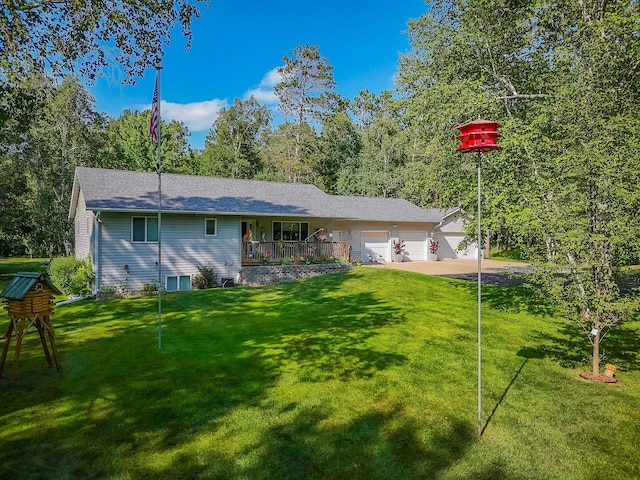 2955 Saint Onge Dr NE, Bemidji, MN 56601 - back of house featuring an attached garage, a lawn, and driveway
