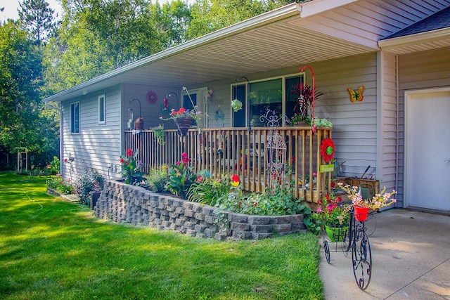 2955 Saint Onge Dr NE, Bemidji, MN 56601 - entrance to property featuring a lawn and covered porch