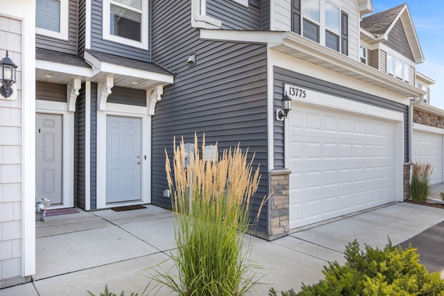 view of exterior entry with a garage