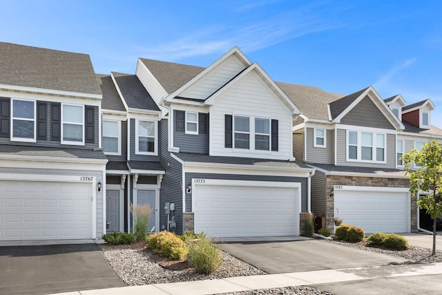 townhome / multi-family property featuring a garage