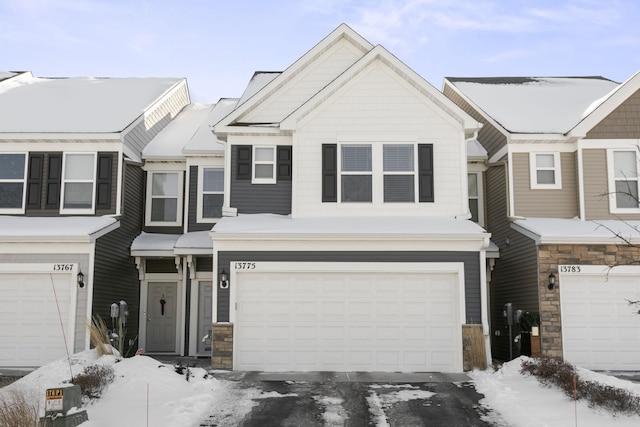 townhome / multi-family property featuring a garage