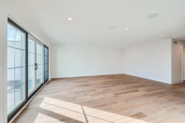 unfurnished room featuring light hardwood / wood-style flooring