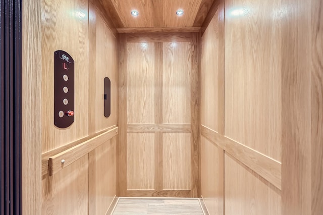 interior details with elevator and wood ceiling