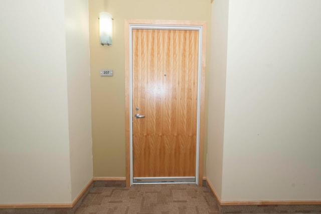 entryway with carpet floors