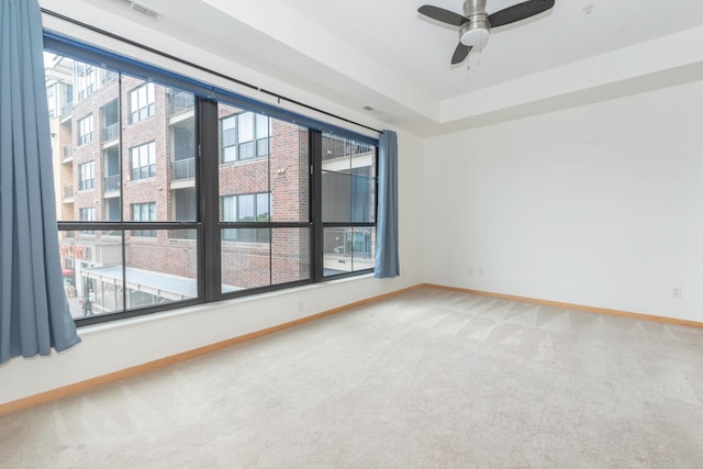 carpeted empty room with ceiling fan