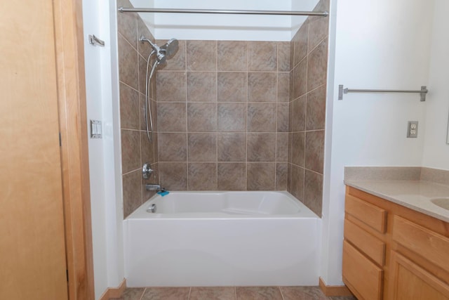 bathroom with vanity, tiled shower / bath combo, and tile patterned floors