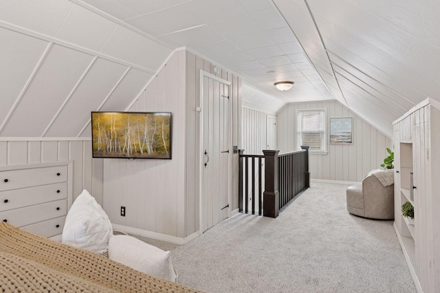 bonus room featuring vaulted ceiling and carpet flooring