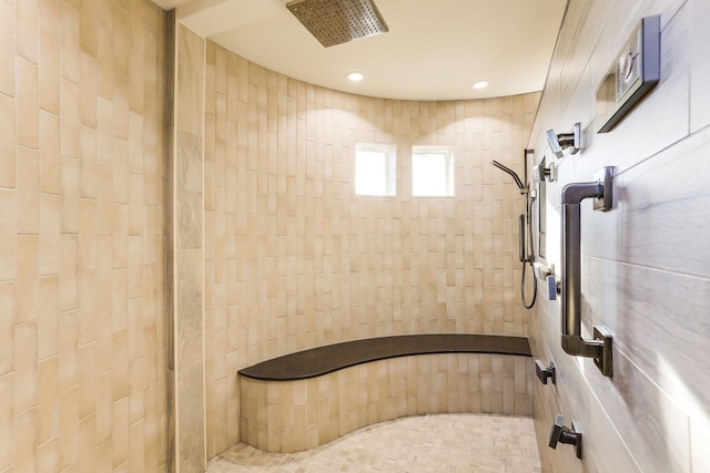 bathroom featuring a tile shower