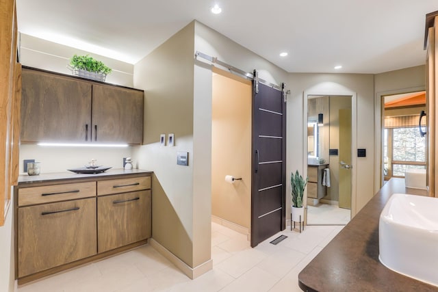 full bathroom with recessed lighting, tile patterned flooring, vanity, and baseboards