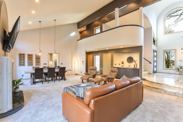 living area featuring carpet floors, stairway, high vaulted ceiling, and recessed lighting