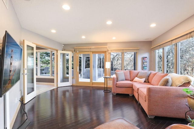 living area featuring a wealth of natural light, recessed lighting, and wood finished floors