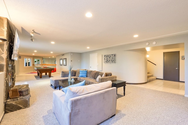 living area featuring light colored carpet, pool table, stairs, a textured ceiling, and recessed lighting