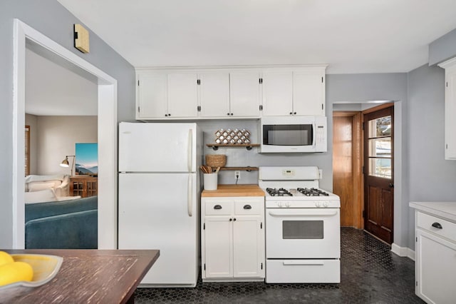 kitchen with white appliances and white cabinets