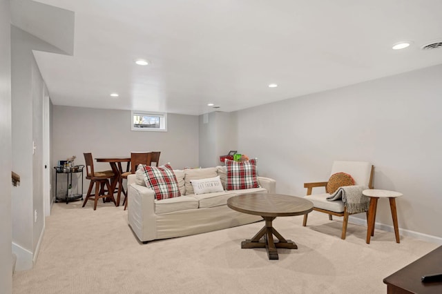 living area with light colored carpet, recessed lighting, visible vents, and baseboards