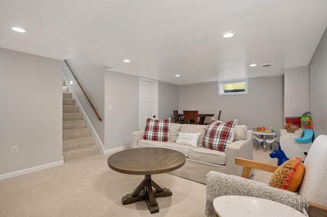 carpeted living room featuring baseboards, stairway, and recessed lighting