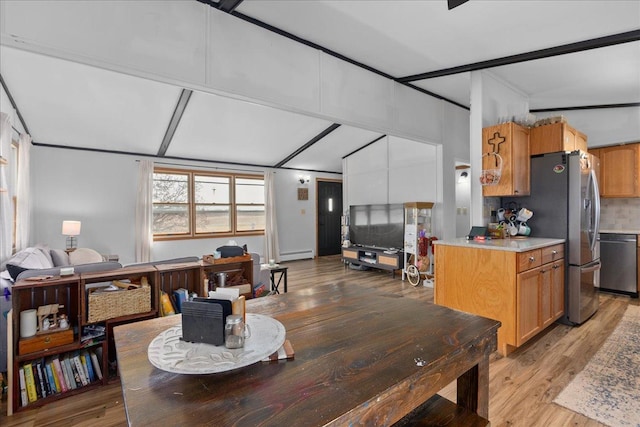 dining room featuring light wood-style floors and a baseboard radiator