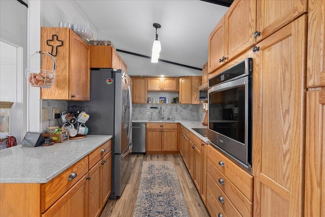 kitchen featuring decorative backsplash, open shelves, lofted ceiling, light wood-style floors, and stainless steel appliances