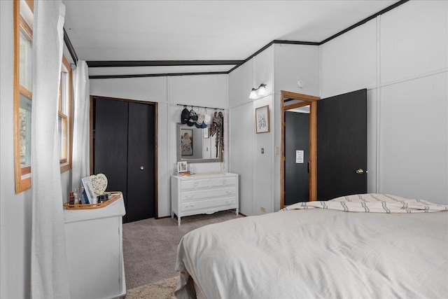 bedroom with carpet and vaulted ceiling
