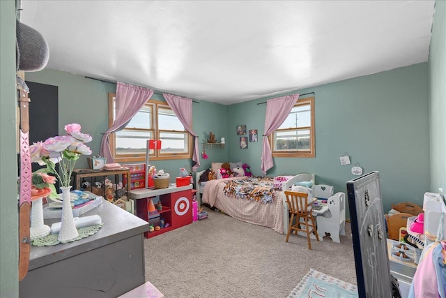 bedroom featuring carpet floors and multiple windows