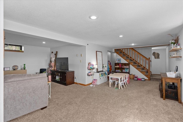 playroom featuring recessed lighting, a textured ceiling, carpet, and baseboards