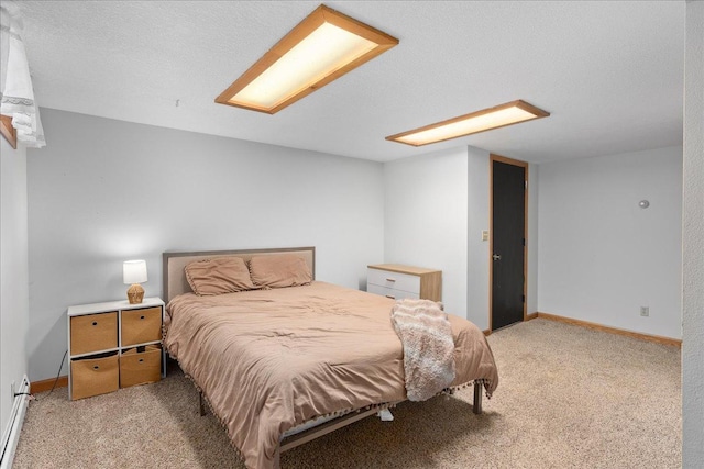 bedroom with carpet flooring and baseboards